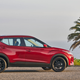 A photo of a red Nissan Kicks SUV